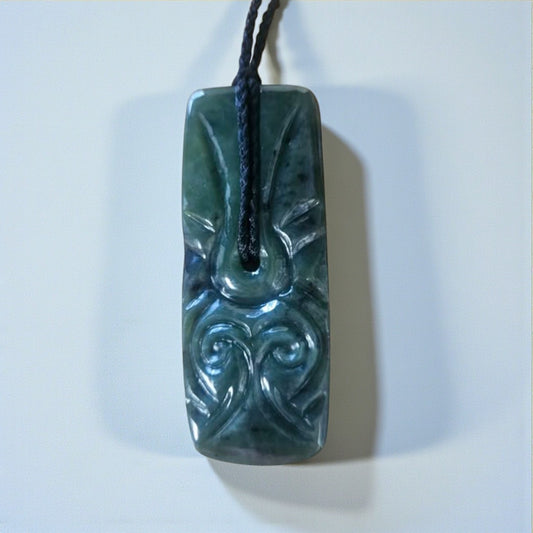 Carved Toki Pendant